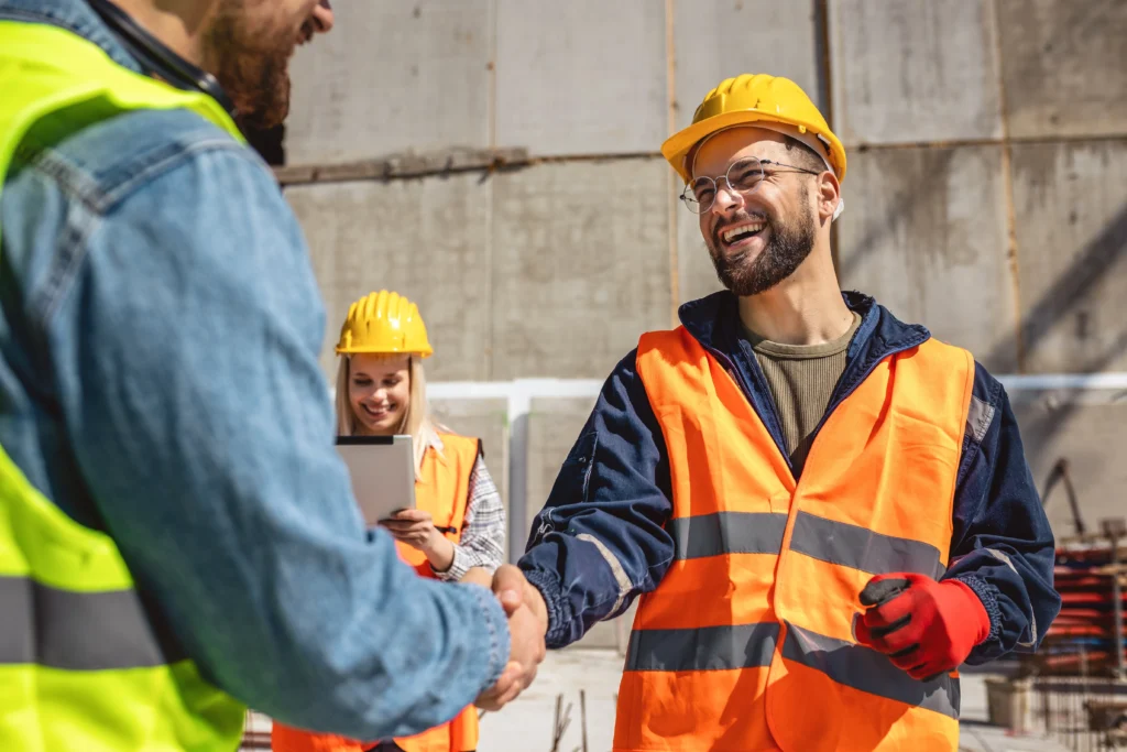 Contractor. construction worker team hands shaking after plan project contract at construction site, contractor, engineering, partnership, construction concept